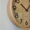 Composition Horloge murale en bois naturel clair